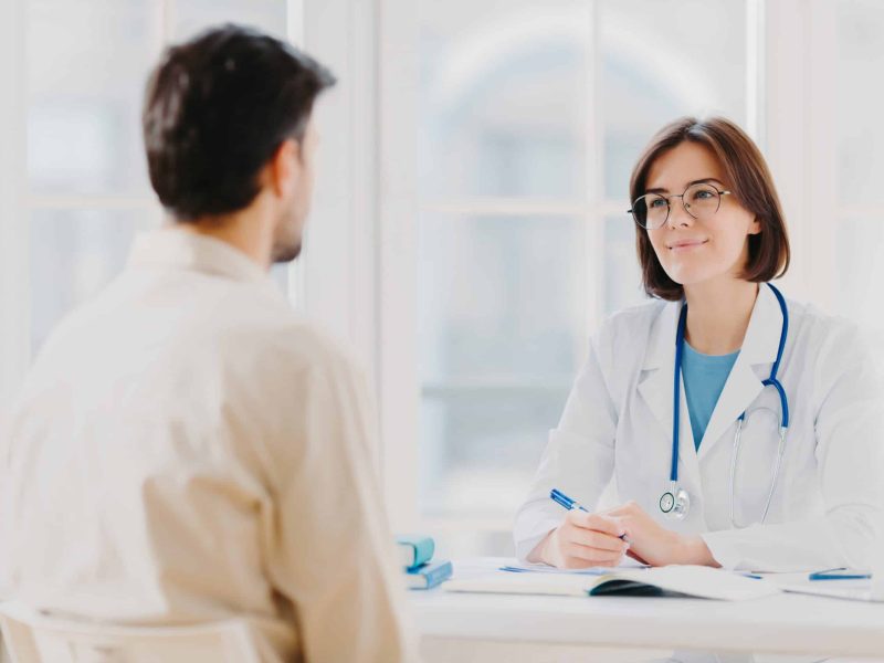 Doctor talking with patient